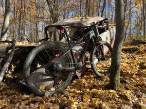 Mtb Bike leaning again old, worn down truck on Vermont bike trail.