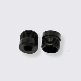 Pedal end caps laid out on a gray background.